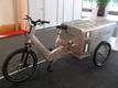 T-Com saves at the employees
A strong electric scooter with trailer would be available for only 2000.-EUR. But T-Com wants to save money only at their employees. A transport bicycle with 250 Watt fuel cell